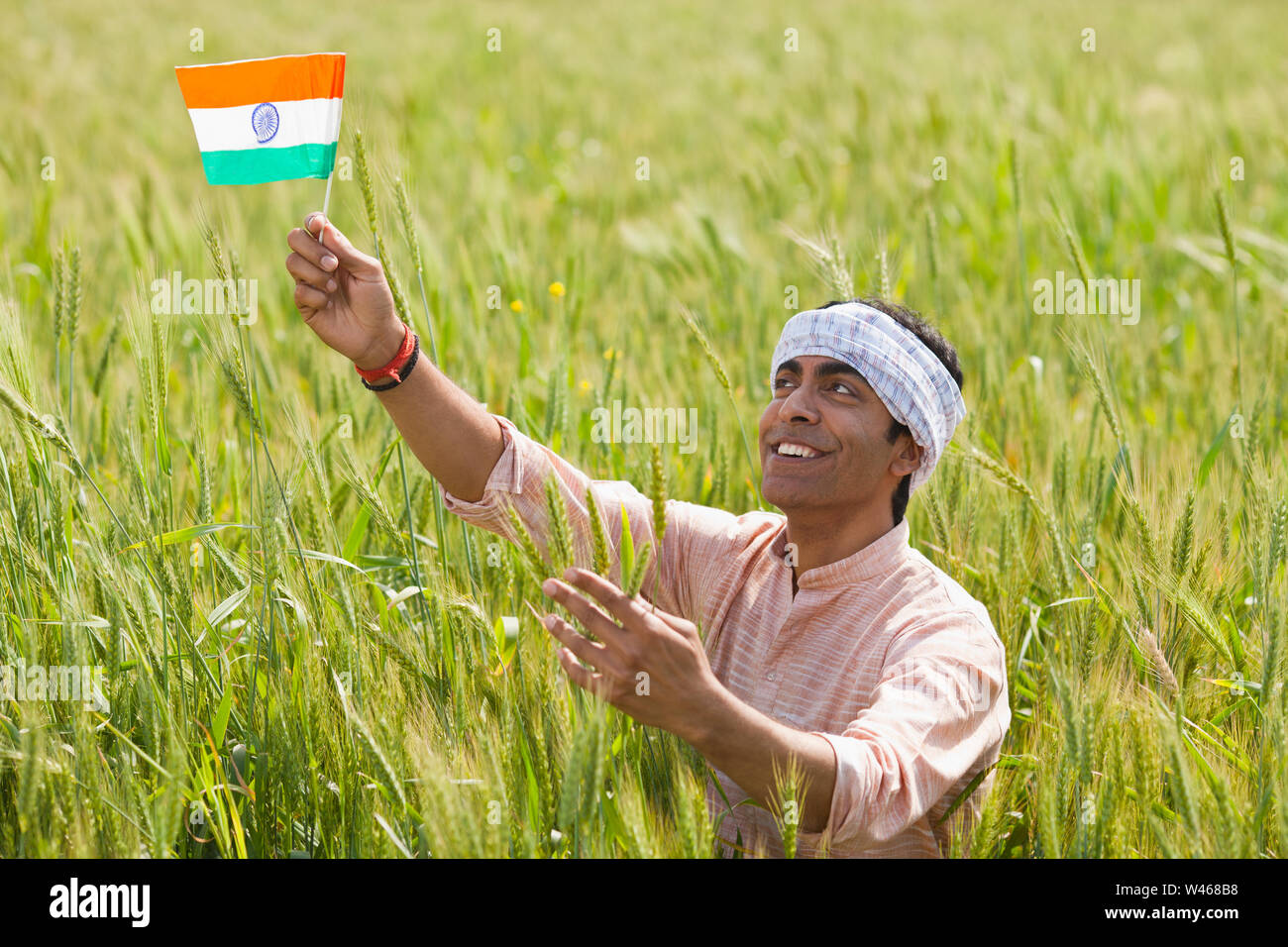 Indian farmer holding indian flag hi-res stock photography and images