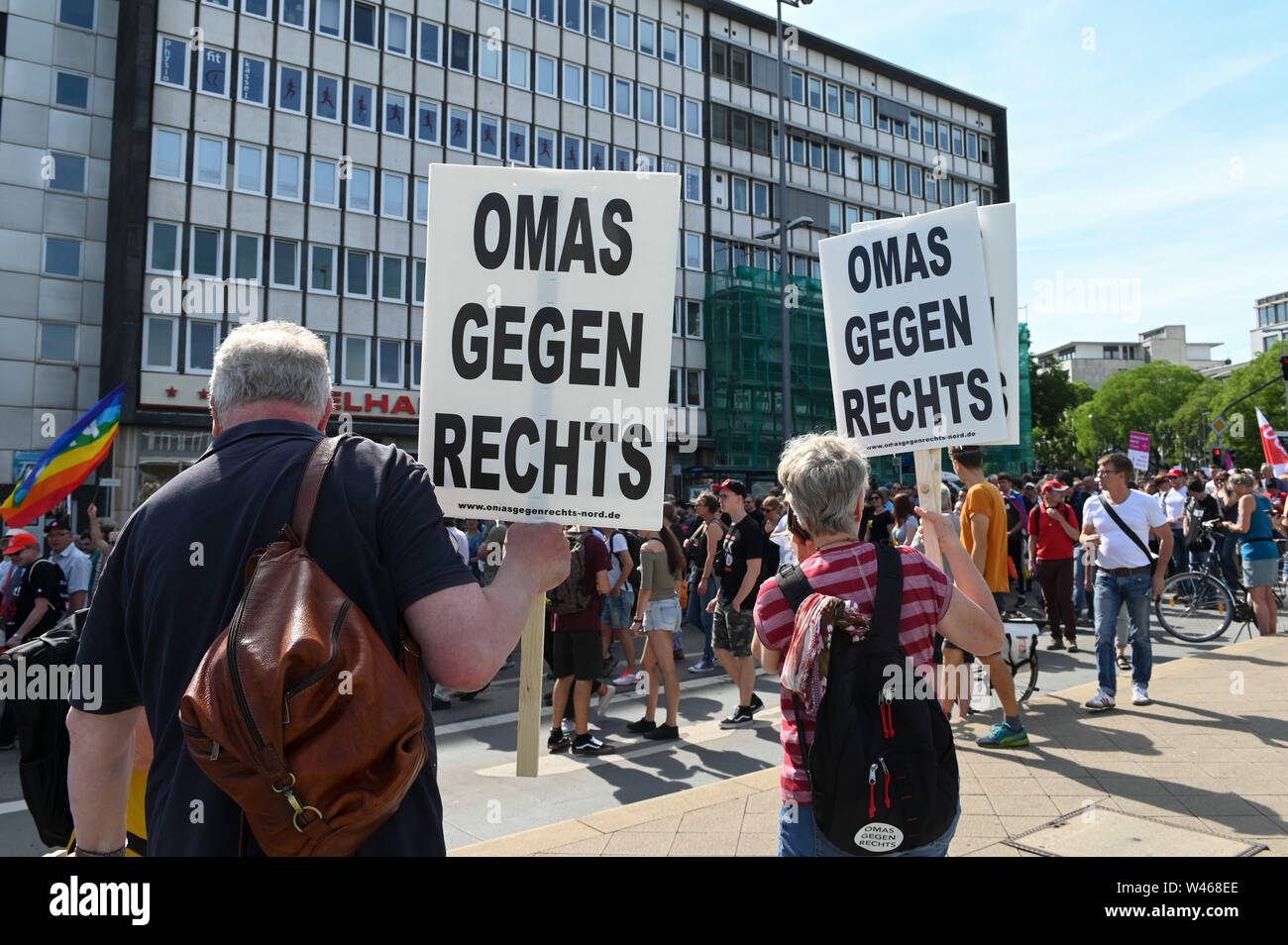 20 July 2019, Hessen, Kassel: Thousands demonstrate against the march of the smallest party 'The Right'. The party had called for a demonstration in Kassel against media prejudgement in connection with the Lübcke case. A massive police presence is to prevent possible riots between the two camps. The posters say 'grandma against right.' Photo: Uwe Zucchi/dpa Stock Photo