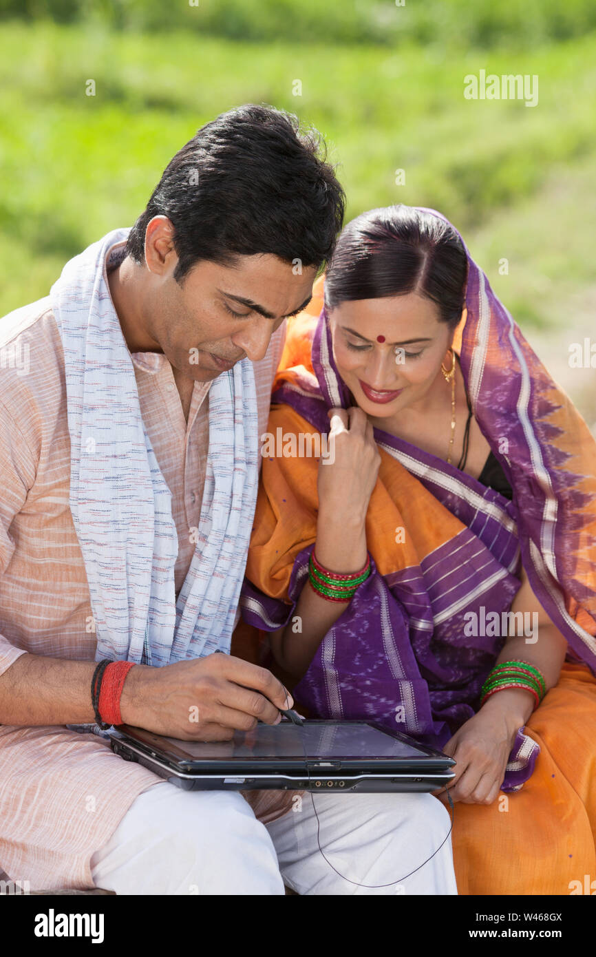 Man using digital tablet with his wife Stock Photo