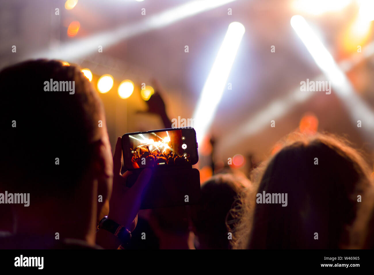 shooting concert on smartphone Stock Photo Alamy