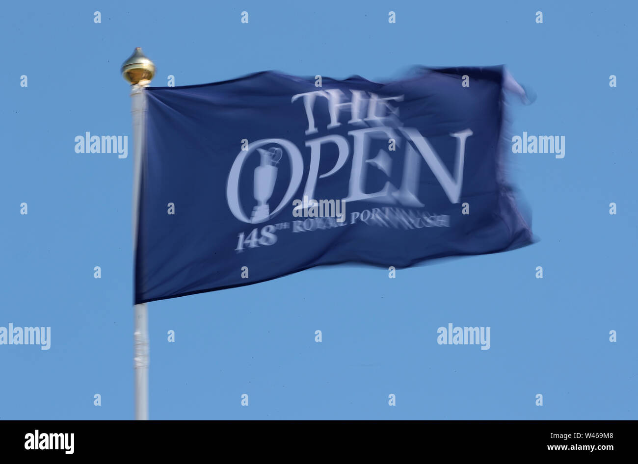 A The Open flag blows in the wind during day three of The Open Championship 2019 at Royal Portrush Golf Club. Stock Photo