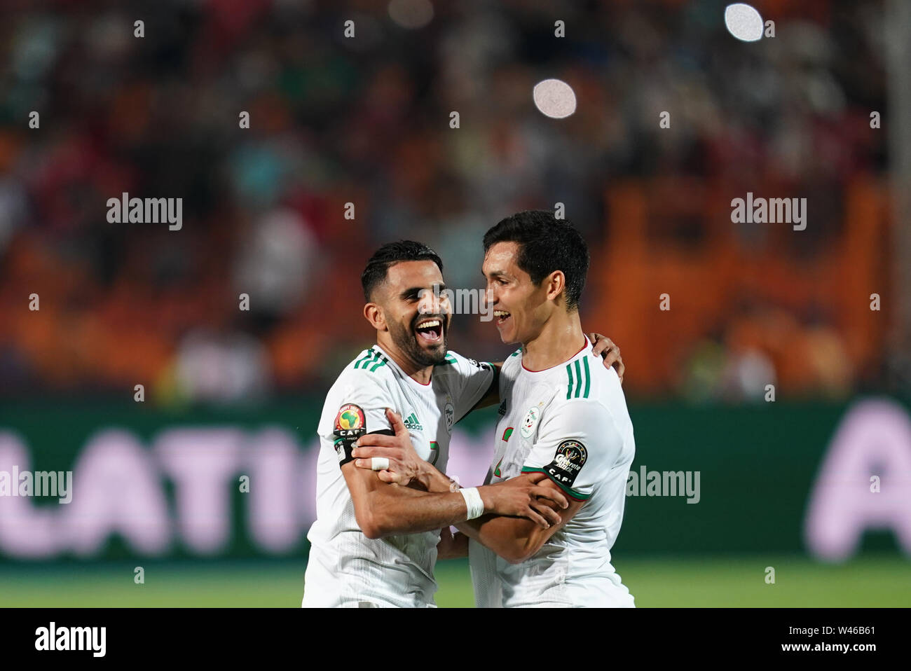 Cairo, Algeria, Egypt. 19th July, 2019. FRANCE OUT July 19, 2019: Riyad Karim Mahrez of Algeria and Aissa Mandi of Algeria celebrating winning after the Final of 2019 African Cup of Nations match between Algeria and Senegal at the Cairo International Stadium in Cairo, Egypt. Ulrik Pedersen/CSM/Alamy Live News Stock Photo