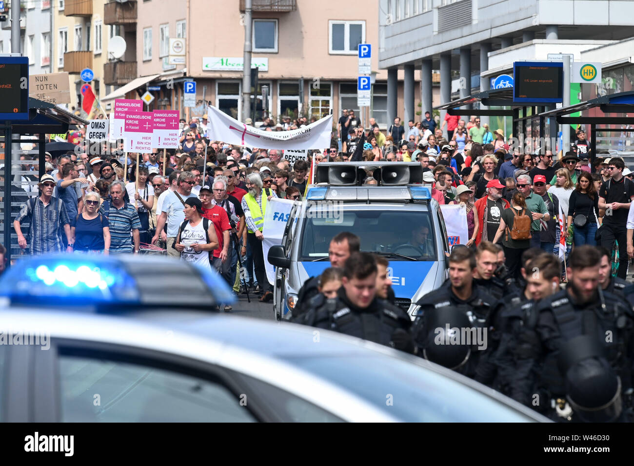 Kassel, Germany. 20th July, 2019. Thousands demonstrate against the march of the smallest party 'The Right'. The party had called for a demonstration in Kassel against media prejudgement in connection with the Lübcke case. A massive police presence is to prevent possible riots between the two camps. Credit: Uwe Zucchi/dpa/Alamy Live News Stock Photo