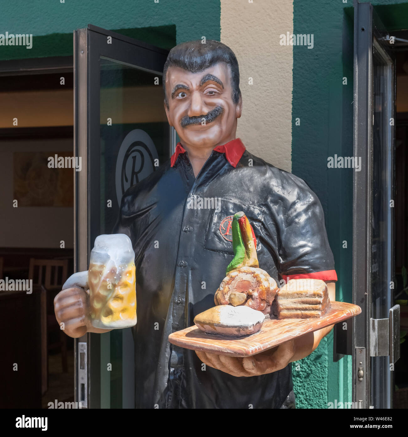 A mannequin with food and drink outside a restaurant at Prater amusement park, Vienna, Austria. Stock Photo