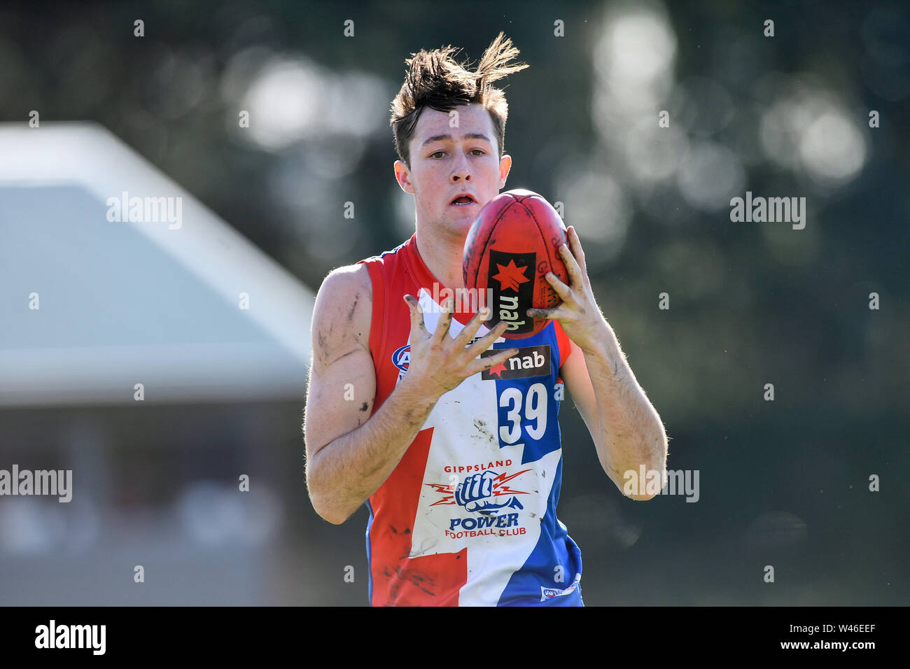 Box Hill City Oval, Melbourne, Australia. 20th July 2019. Australian Rules Football Under 18s Championships, Gippsland Power versus Tasmania Devils; Mason Hawkins of the Gippsland Power takes possession of the ball Credit: Action Plus Sports Images/Alamy Live News Stock Photo