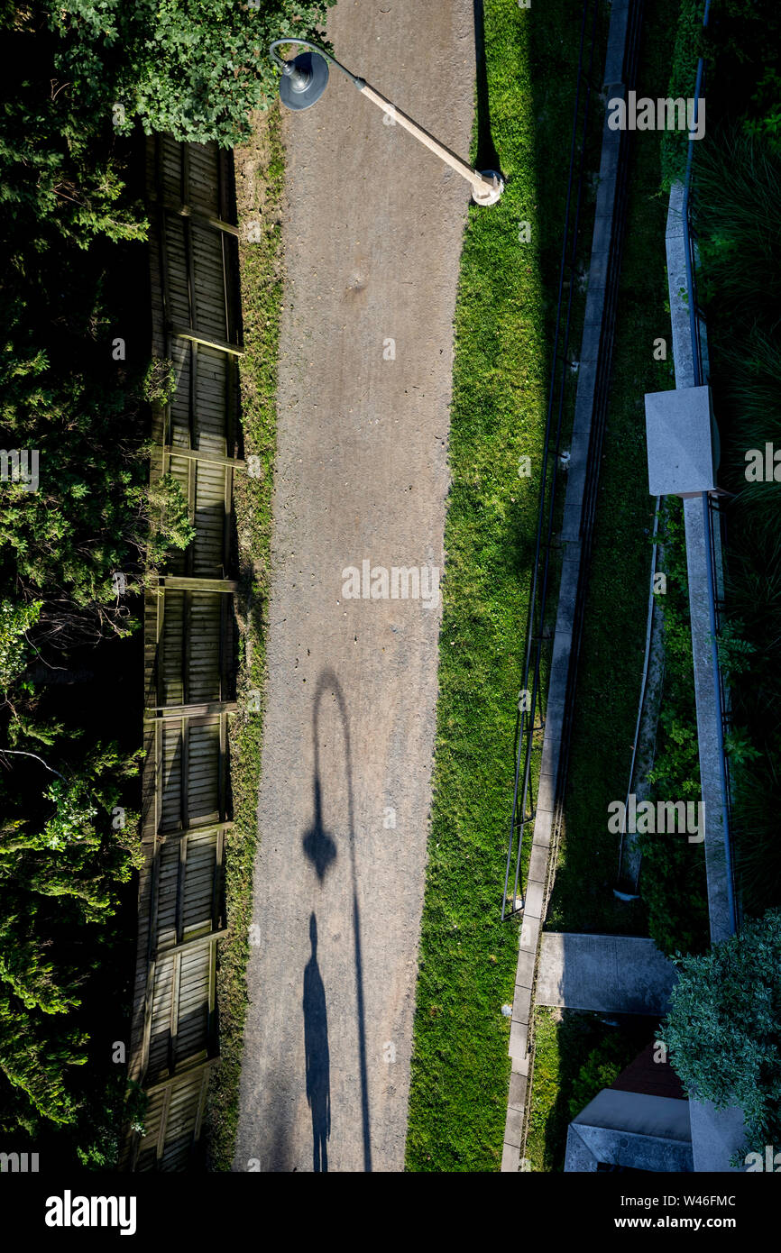 Shadow of a walker on the Beltline in Davisville, Toronto, Ontario, Canada Stock Photo