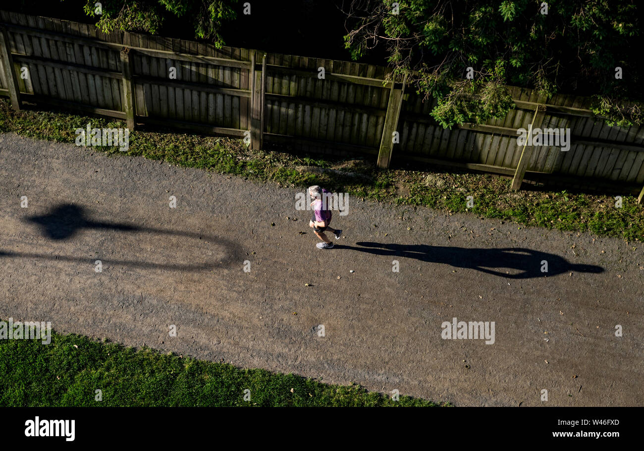 A jogger on the Beltline in Davisville, Toronto, Ontario, Canada Stock Photo