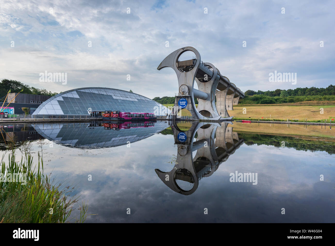 The Falkirk Wheel in Scotland is a rotating canal boat lift a form of high rise lock connecting the Forth and Clyde Canal with the Union Canal. Stock Photo