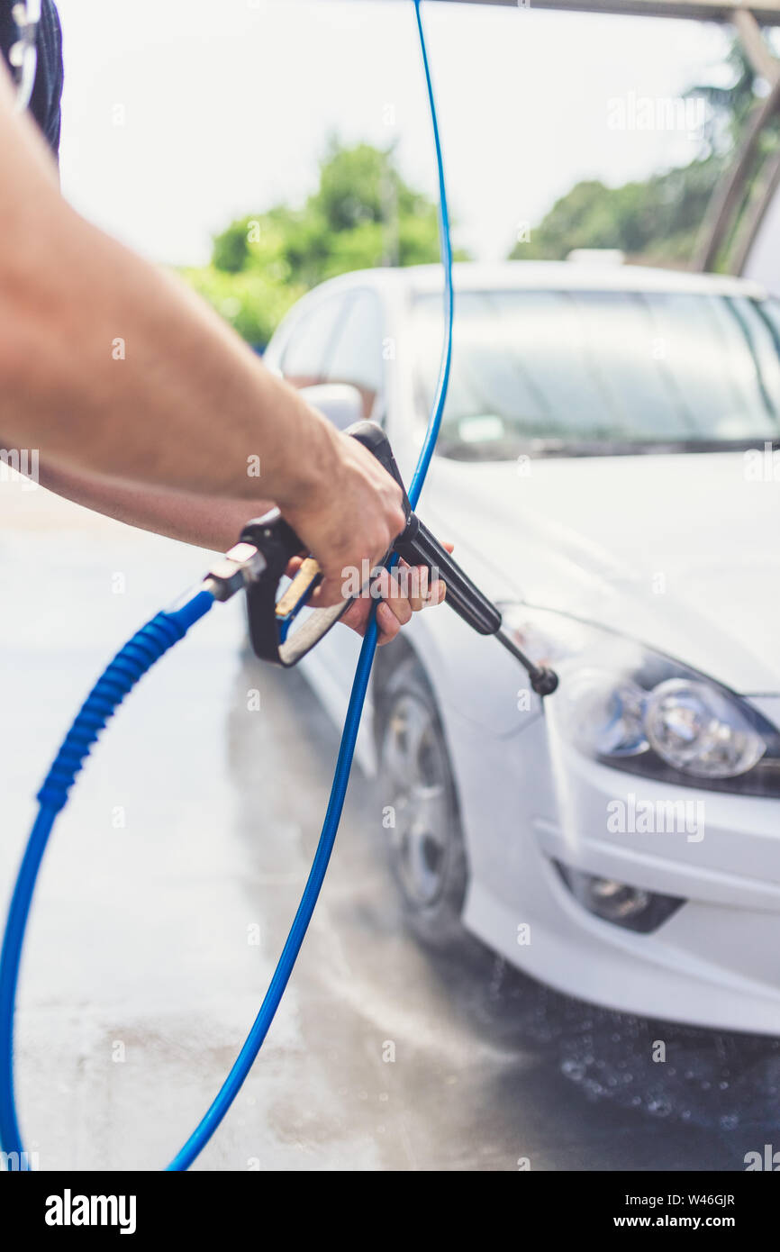 Close Up of Man Cleaning Car with Cloth and Spray Bottle, Car