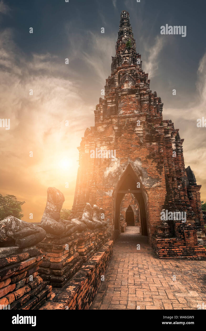 Asian religious architecture. Ancient Buddhist pagoda ruins at Chai Watthanaram temple under sunset sky. Ayutthaya, Thailand travel landscape and dest Stock Photo