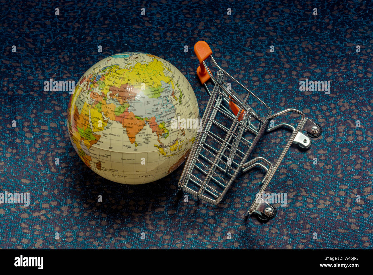 World Globe and Shopping cart or shopping trolley as business concept Stock Photo