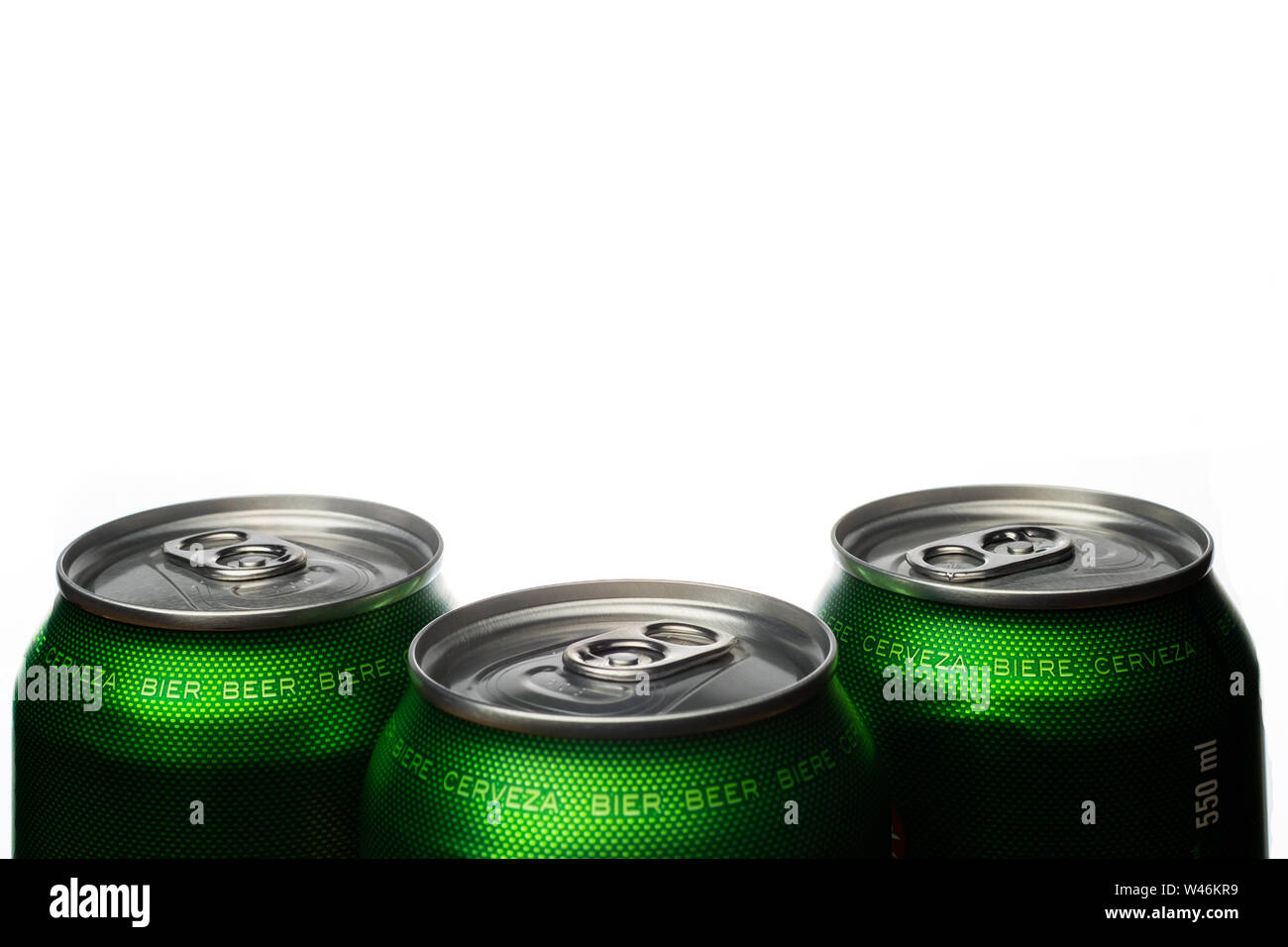 Three green cans of beer. Background for a pub. Beer store. Relax at
