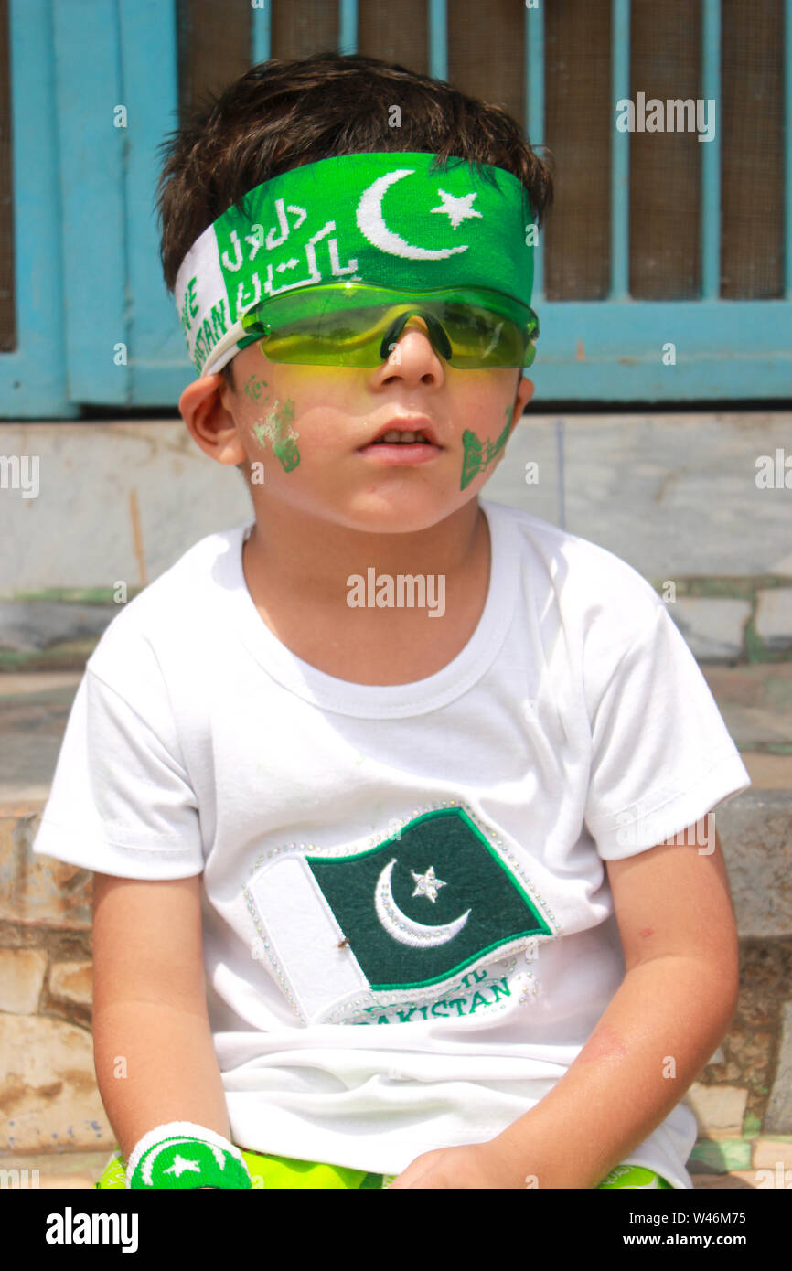 children wearing green and white colors dress and held in hands Pakistani  flags Stock Photo - Alamy