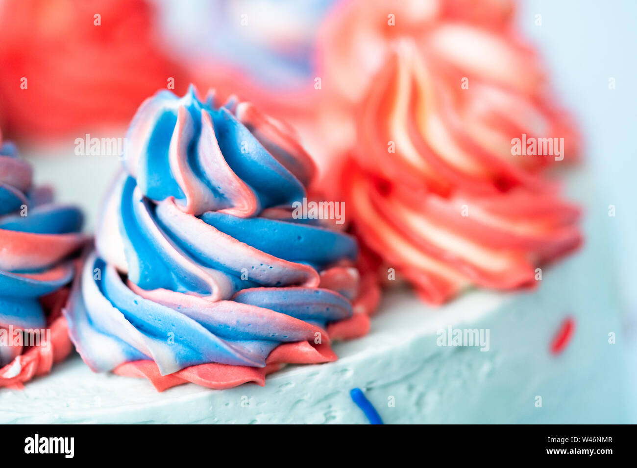Red, white, and blue round cake frosted with buttercream frosting Stock