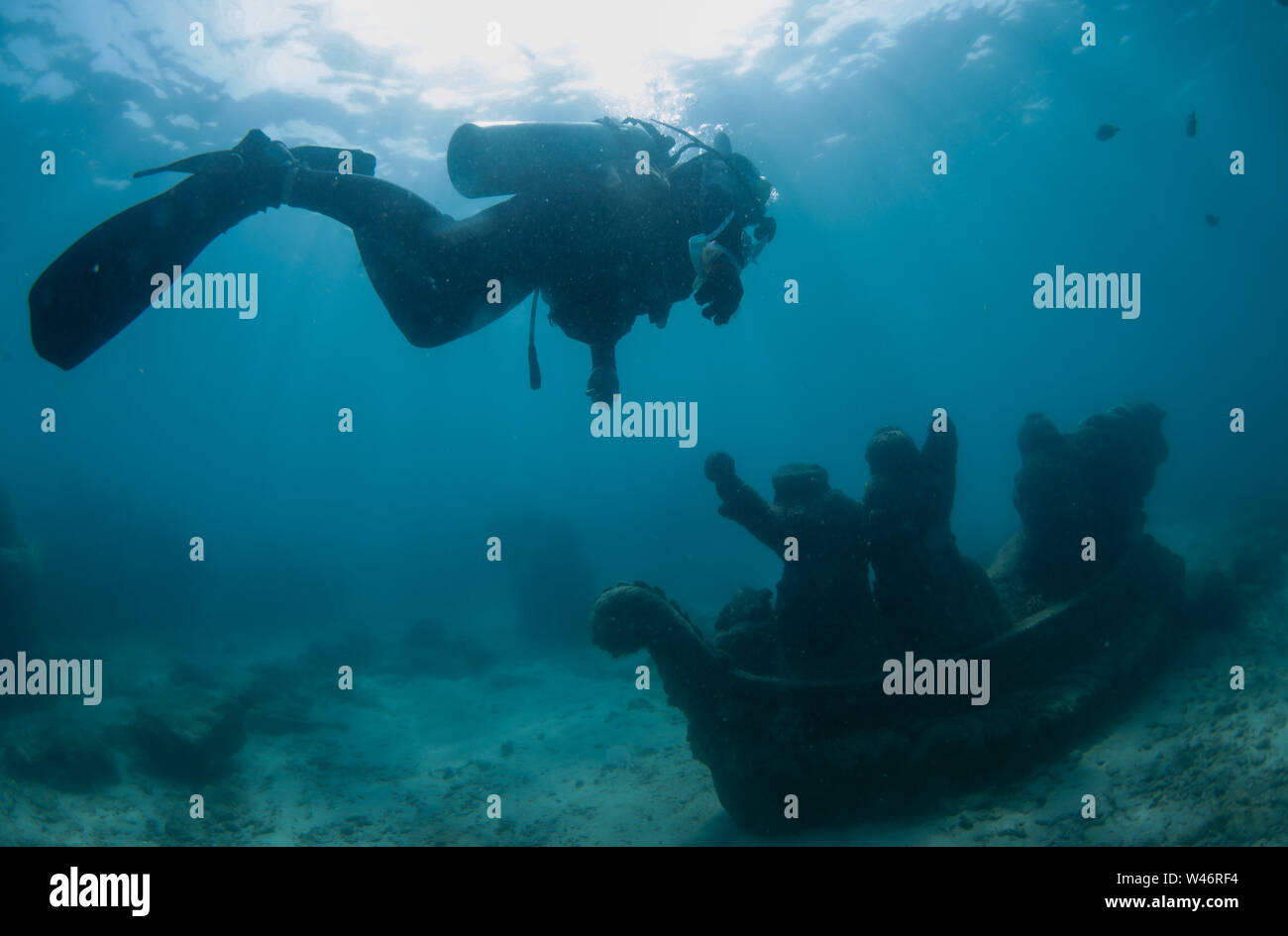 (190720) -- LINGSHUI, July 20, 2019 (Xinhua) -- A diving coach searches for underwater litter at the Boundary Island Tourist Attraction in Lingshui County, south China's Hainan Province, July 20, 2019. Boundary Island in south China's Hainan Province is hosting its first series of diving-themed activities from July 19 to 21, attracting diving enthusiasts, tourists, marine ecologists and diving equipment dealers worldwide. The PADI (Professional Association of Diving Instructors) Women Dive Day event was also held here on Saturday alongside the main events. (Xinhua/Yang Guanyu) Credit: Xinhua/A Stock Photo