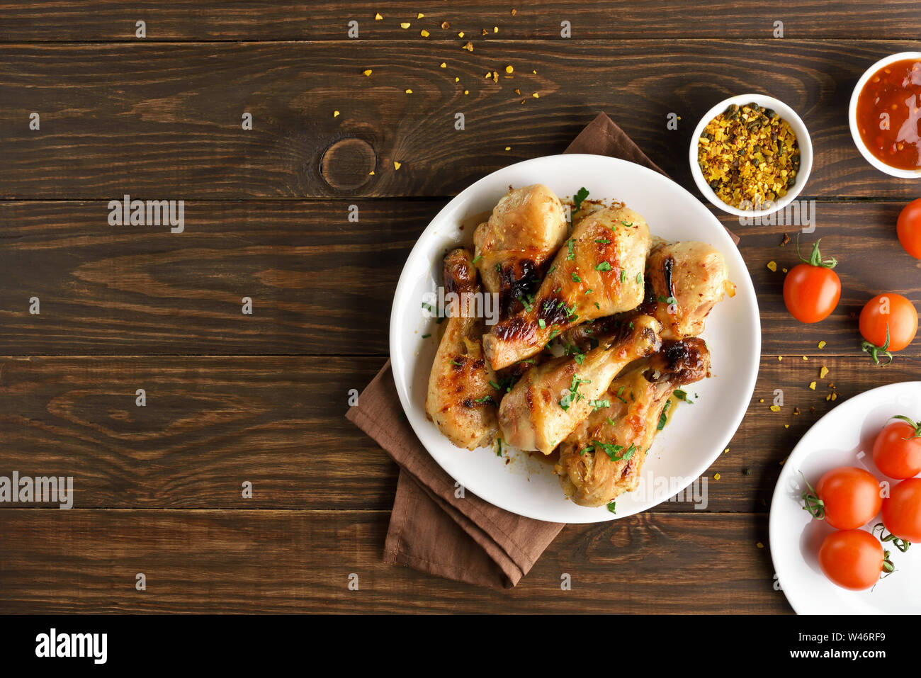 Grilled chicken drumstick on white plate, top view Stock Photo