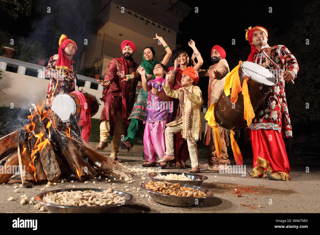 Family celebrating Lohri festival, Punjab, India Stock Photo Alamy