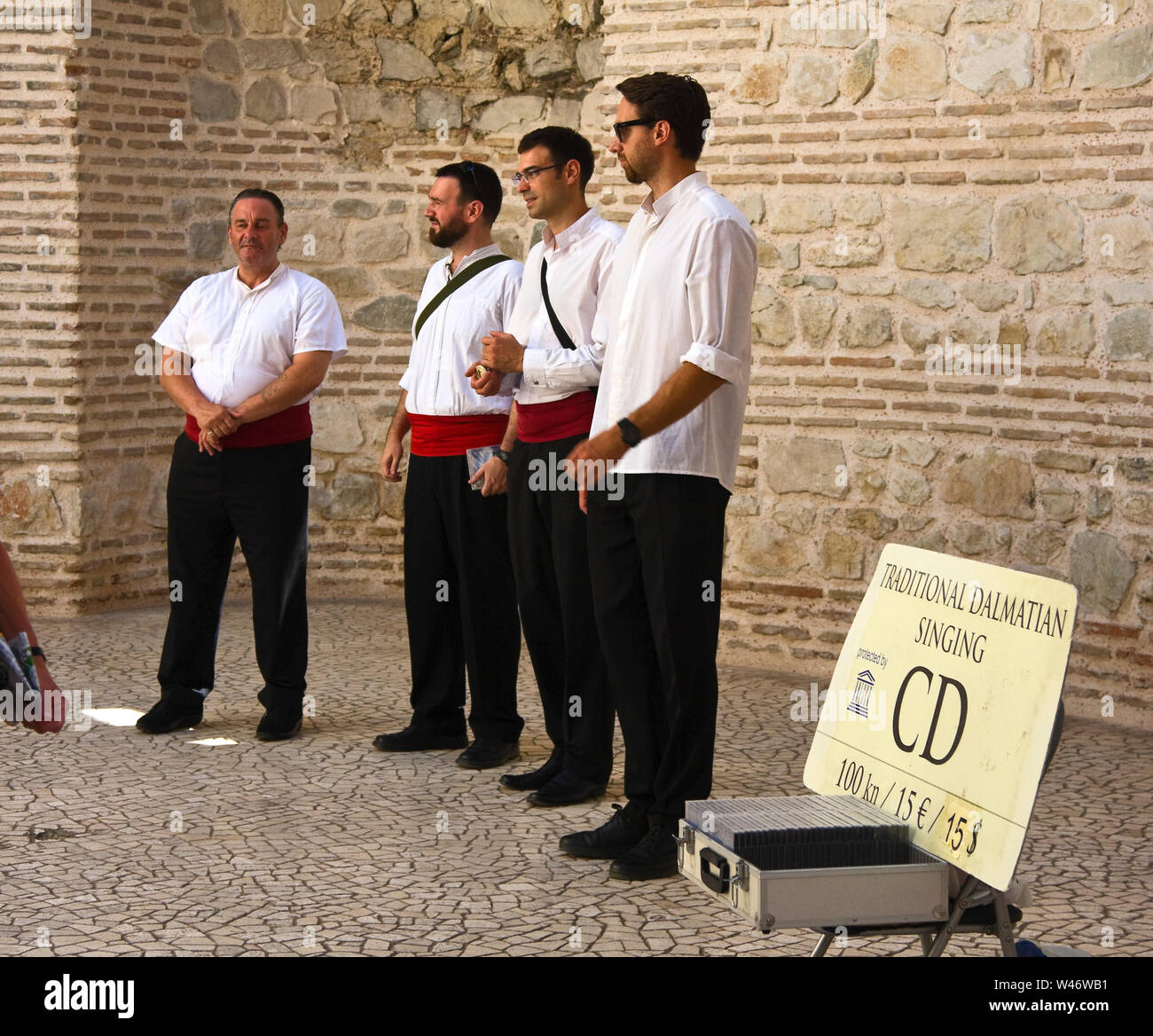 Klapa group singing a cappella, men entertaining, folk music, harmonious, public entertainment, Diocletian's Palace, Central Dalmatia, Split; Croatia; Stock Photo