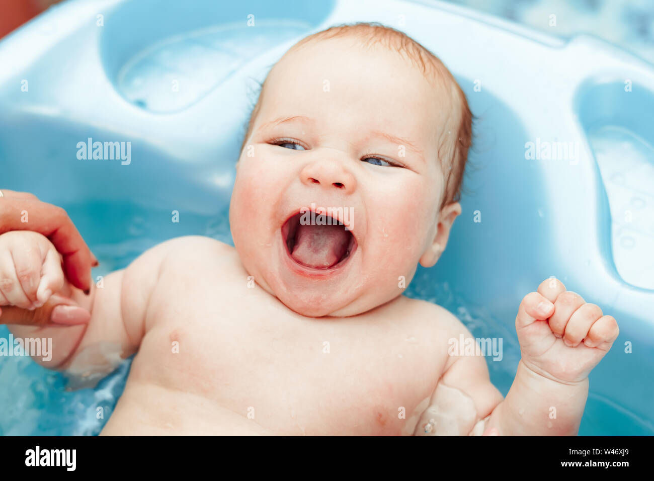 baby boy bathed in the outdoor tub Stock Photo Alamy