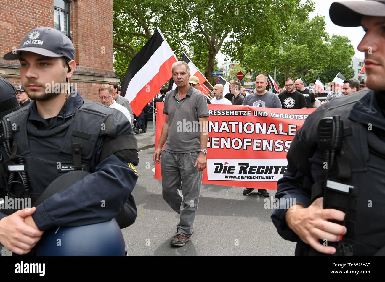 Hanover, Germany. Kassel, Germany. 20th July, 2019. Organizer Christian Worch leads the demonstration of supporters of the right-wing extremist small party 'Die Rechte' (The Right). The party had called for a demonstration in Kassel against media prejudgement in connection with the Lübcke case. A massive police presence is to prevent possible riots between the two camps. Credit: Uwe Zucchi/dpa/Alamy Live News Stock Photo