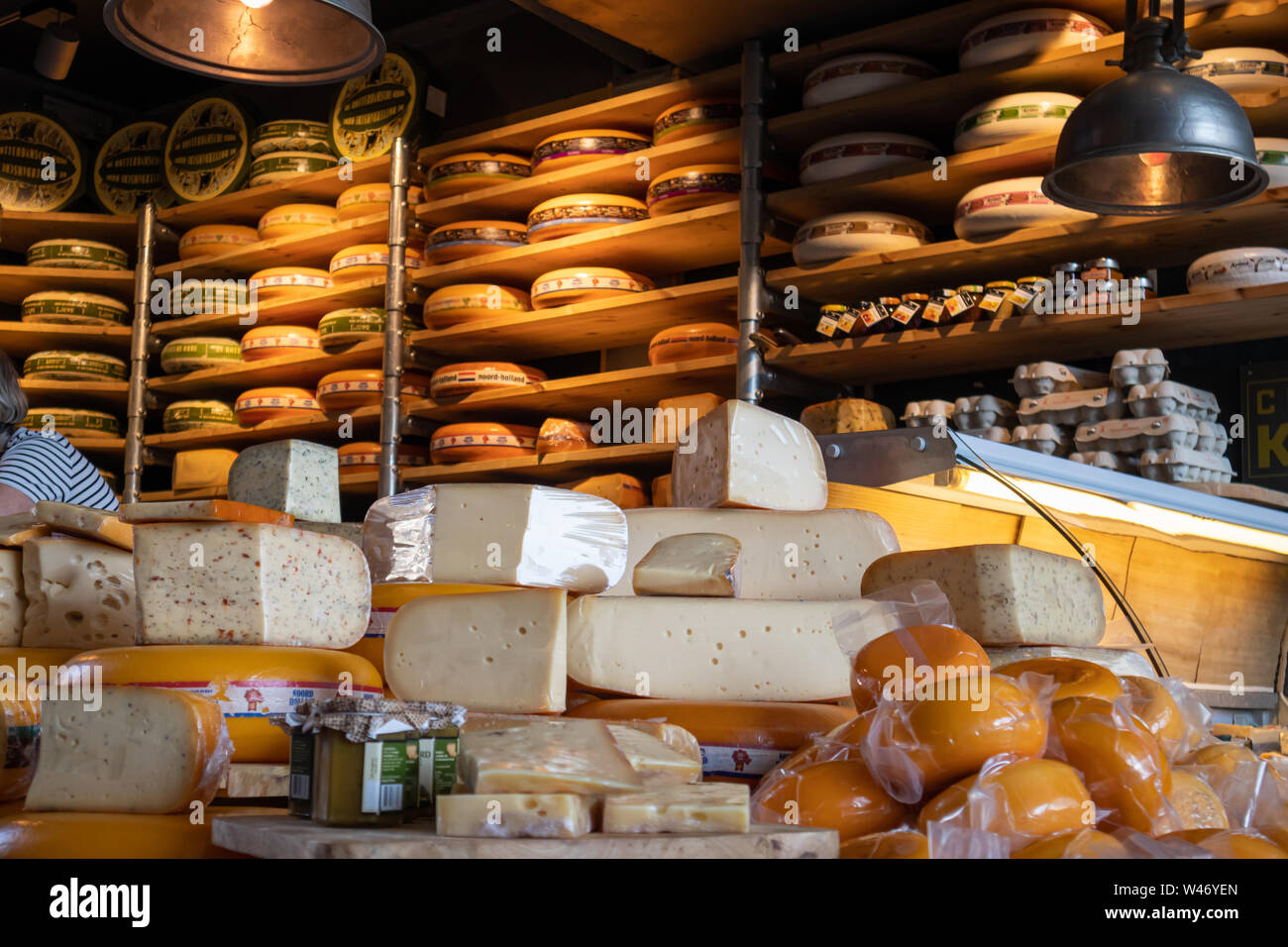 Rotterdam Netherlands, June 27, 2019. Dutch cheeses, edam, gouda, whole round wheels in a traditional cheese store in Rotterdam markthal Stock Photo