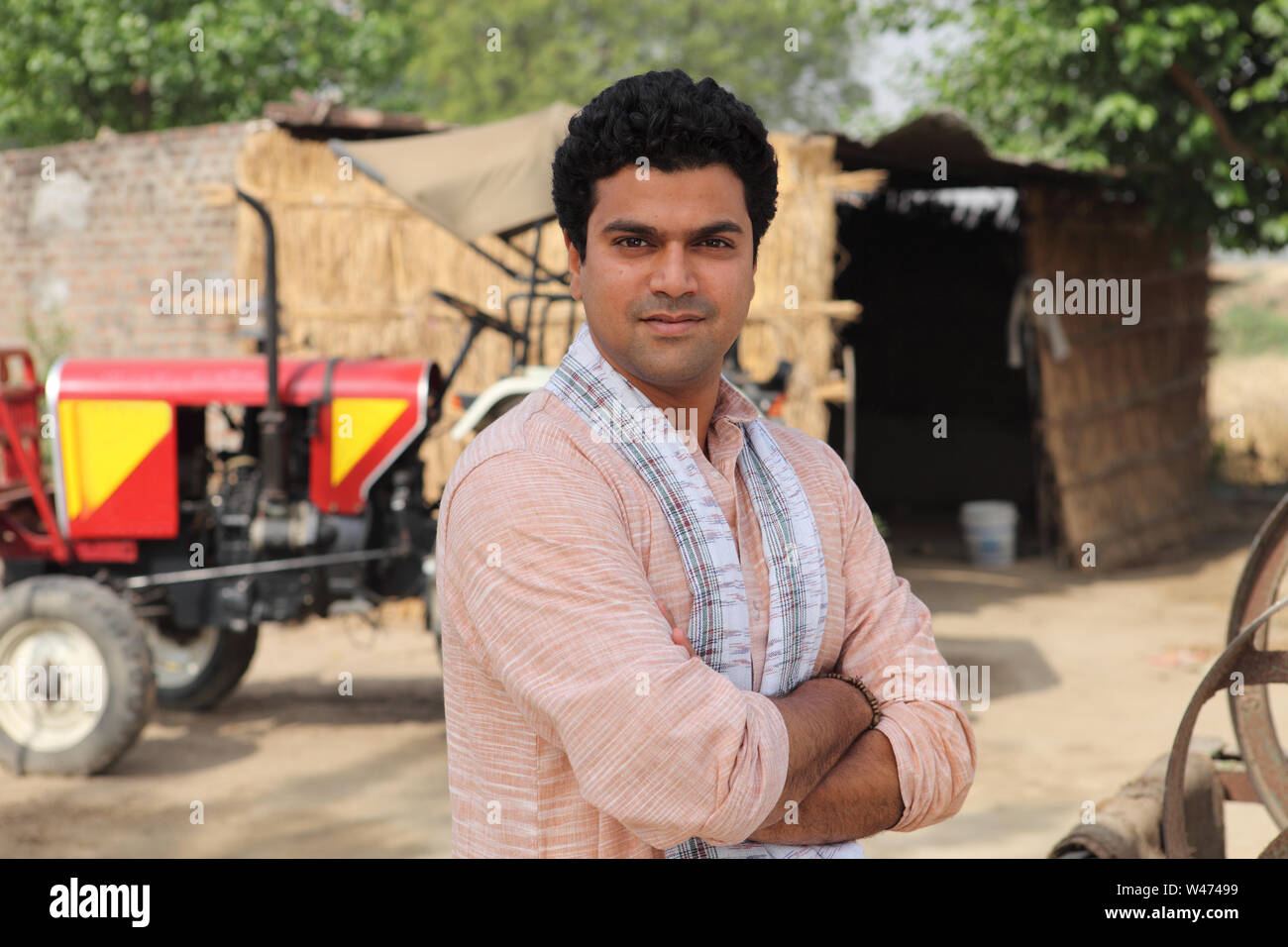 Portrait of a farmer standing with his arms crossed Stock Photo - Alamy