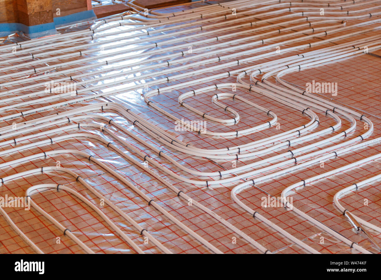 Underfloor surface heating pipes. Low temperature heating concept. Stock Photo