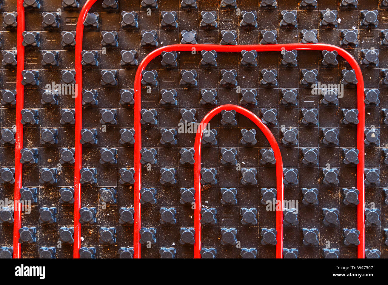 Underfloor heating pipes. Low temperature heating concept Stock Photo