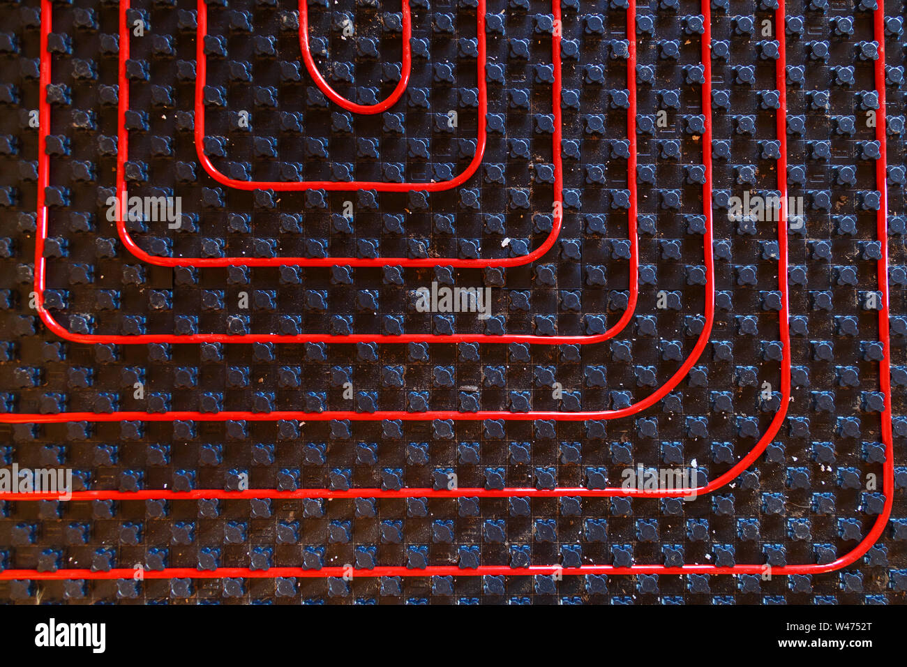 Underfloor heating pipes. Low temperature heating concept Stock Photo