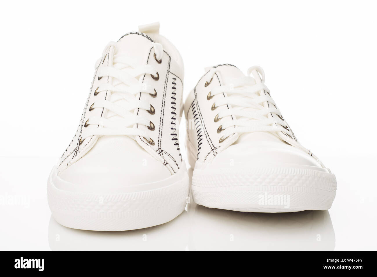 Fashionable white walking shoes on a white background. - image Stock Photo