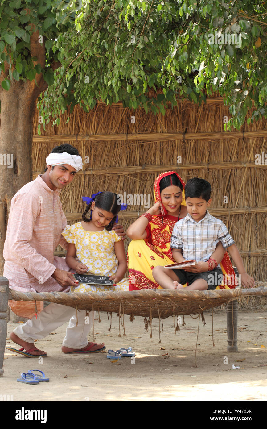 Parents Teaching Their Children Stock Photo Alamy Parents teaching their children stock photo alamy