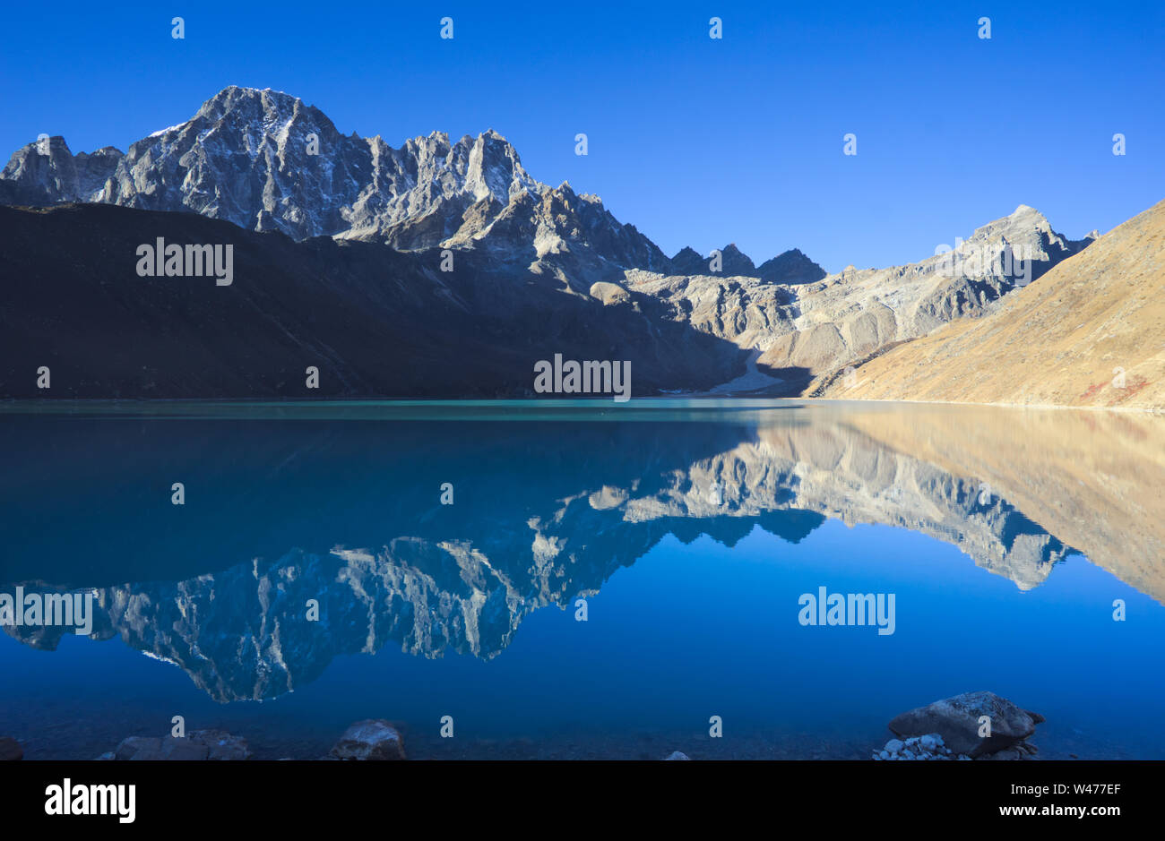 Reflection in Gokyo lake, Everest region, Nepal Stock Photo