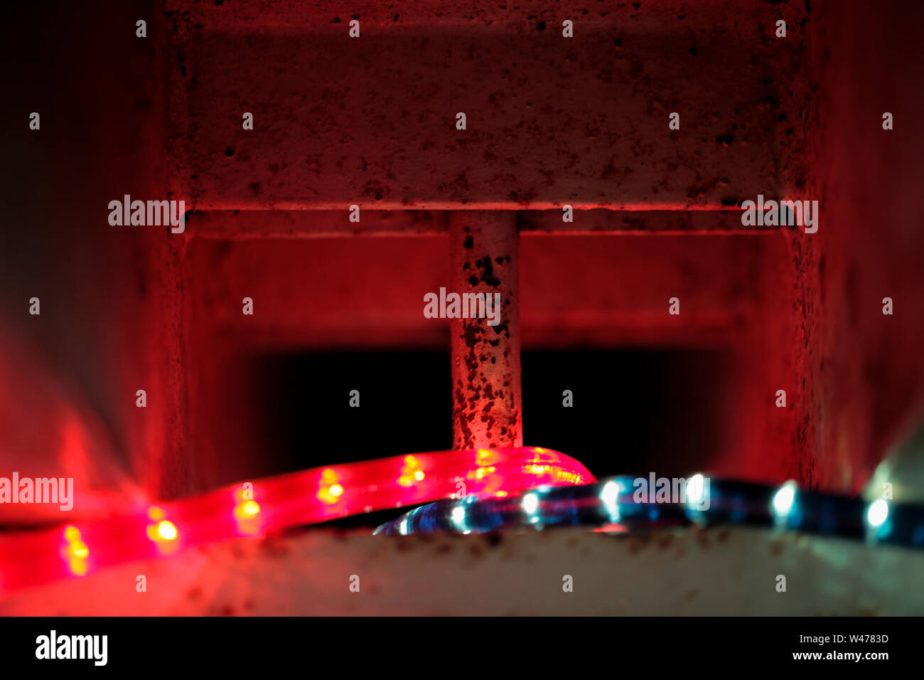 LED light strings in a metall shaft one is blue the other red Stock Photo
