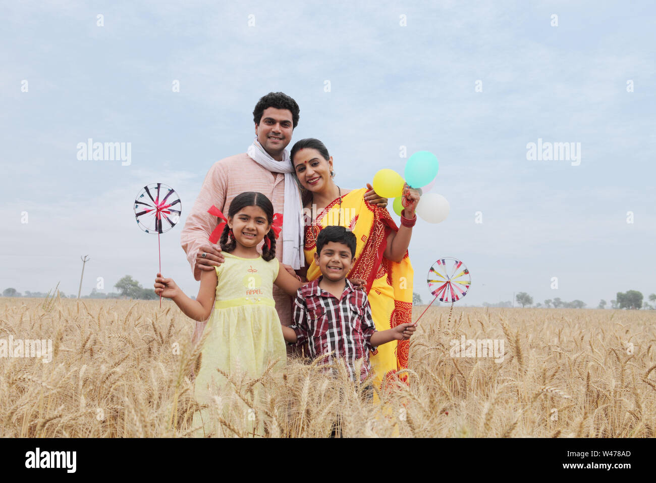 Smiling Rural Kid Rural family standing and smiling in a field Stock Photo - Alamy