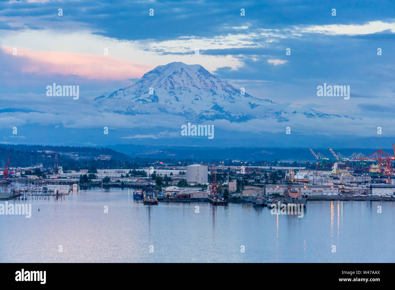 A view of Mount Rainier and the Port of Tacoma at twilight Stock Photo ...