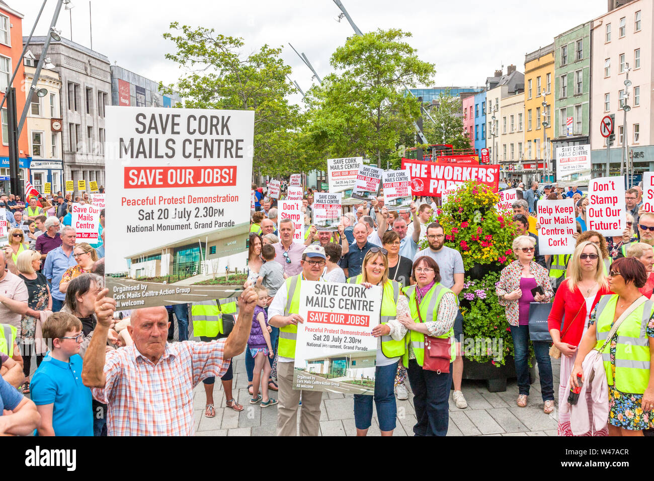 Cork City, Cork, Ireland. 20th July, 2019. Postal workers march in protest against the proposed closure by An Post of its distribution centre in Little Island with the loss of 250 jobs, on the streets of Cork, Ireland. -Credit;  David Creedon / Alamy Live News Stock Photo