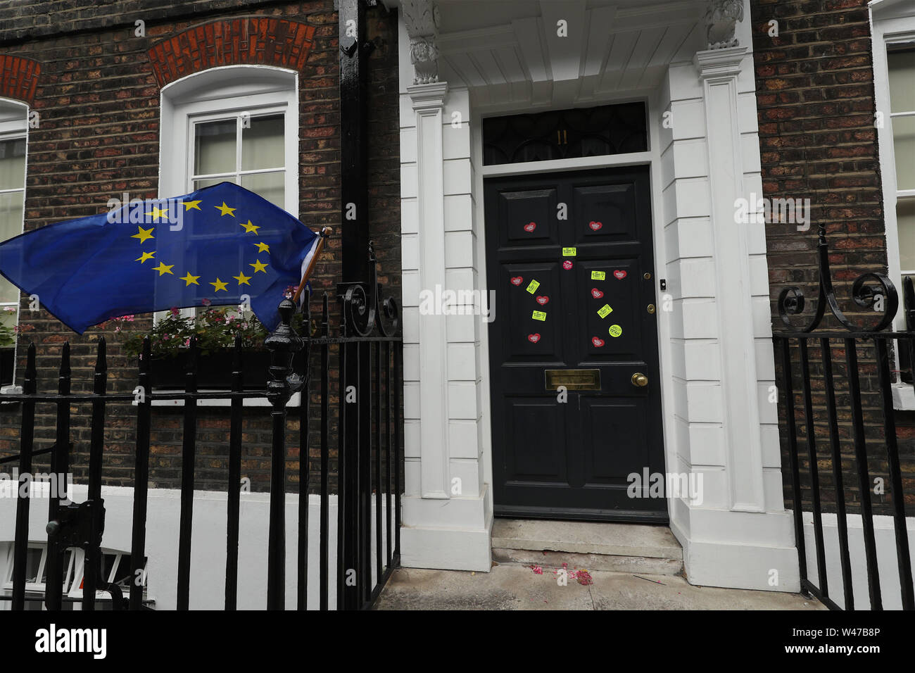 Anti-Brexit stickers and an EU flag are placed outside the campaign HQ of Boris Johnson in Westminster, London. Stock Photo