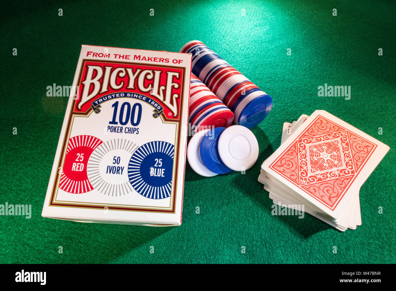 Still Life Bicycle Brand Poker Chips and Deck of Cards on a Green Felt Card Game Table, USA Stock Photo