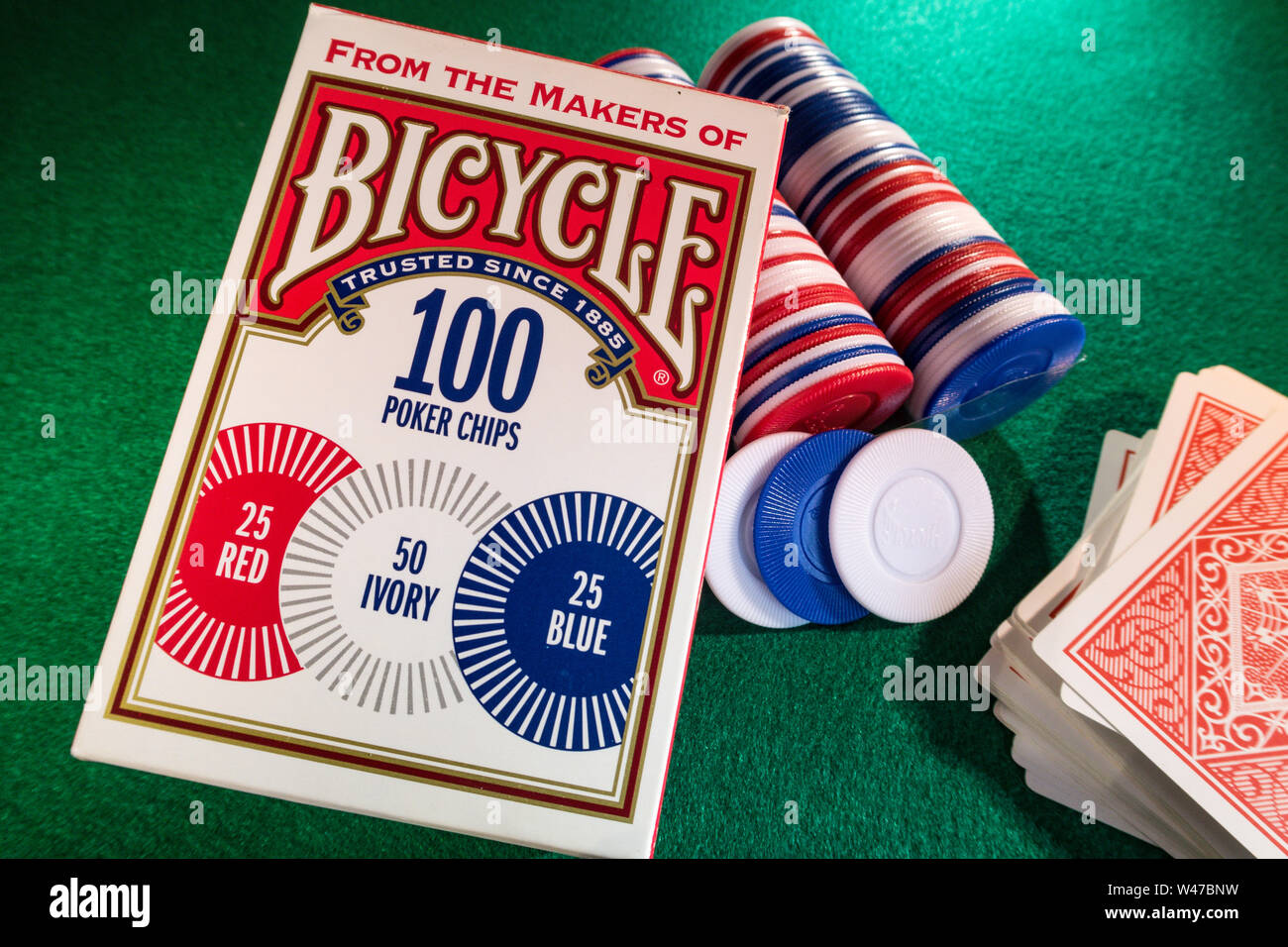 Still Life Bicycle Brand Poker Chips and Deck of Cards on a Green Felt Card Game Table, USA Stock Photo