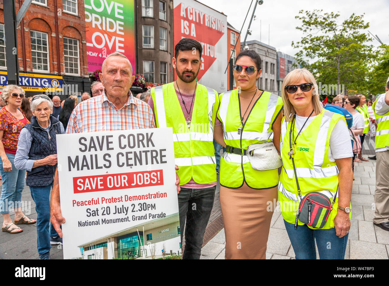 Cork City, Cork, Ireland. 20th July, 2019. Frank O' Flarthy, Darren Ghambari, Aoife Ghambari and Deirdre Ghambari at the postal workers march in protest against the proposed closure by An Post of its distribution centre in Little Island with the loss of 250 jobs, on the streets of Cork, Ireland. -Credit;  David Creedon / Alamy Live News Stock Photo