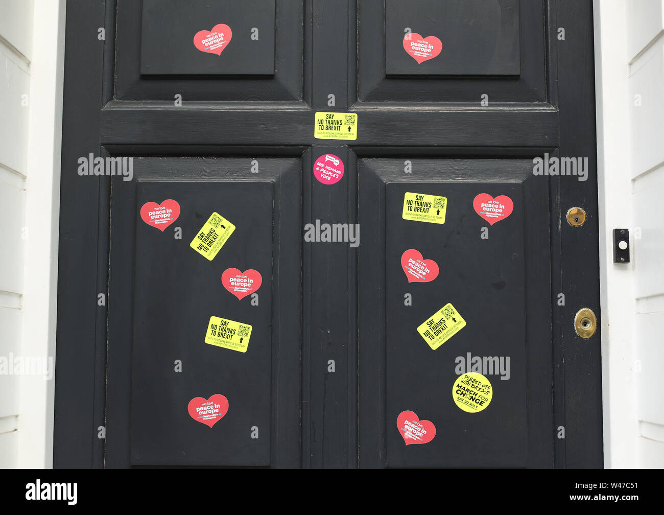 Anti-Brexit stickers and an EU flag are placed outside the campaign HQ of Boris Johnson in Westminster, London. Stock Photo