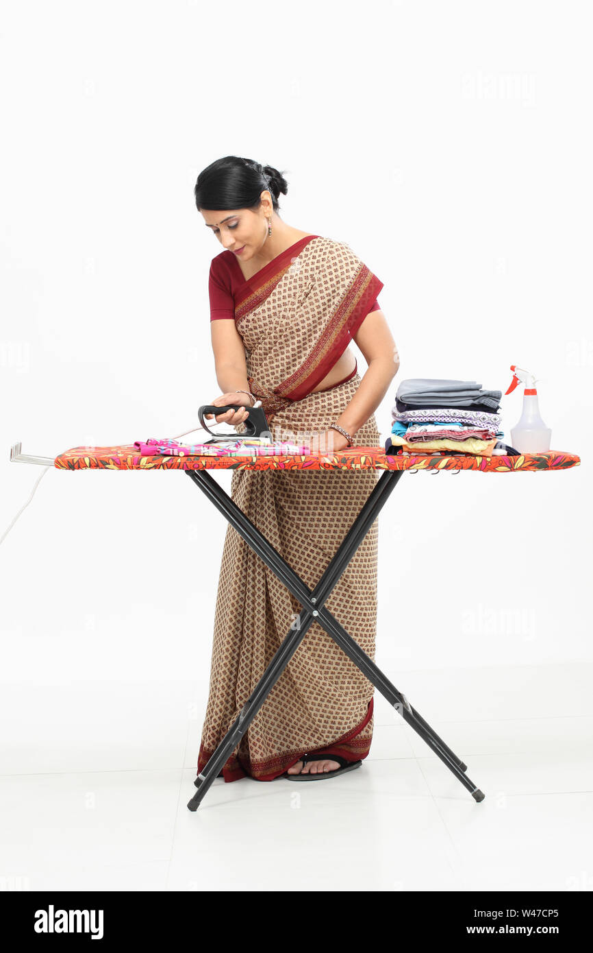 Woman ironing clothes Stock Photo