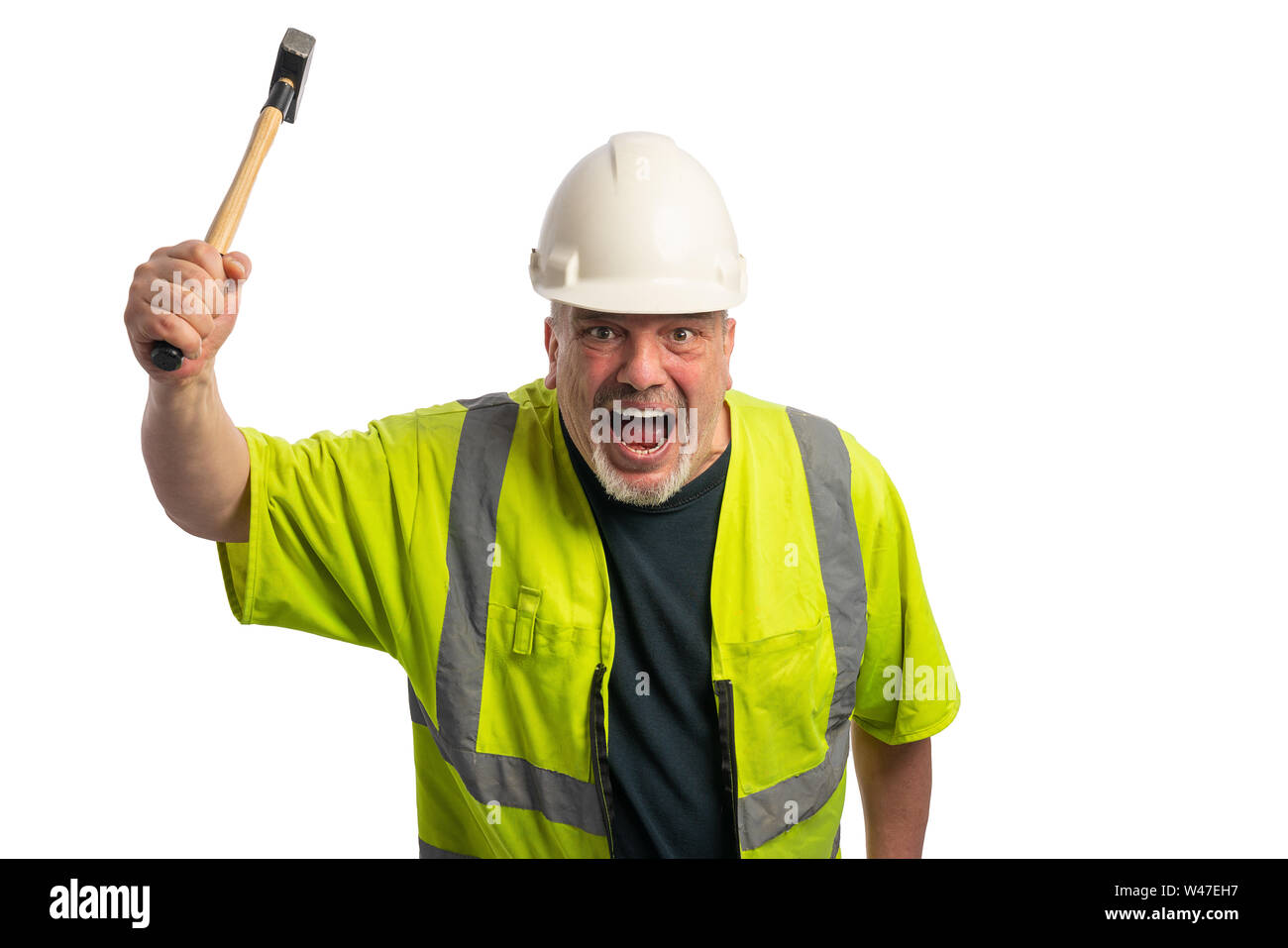 a construction worker with helmet and hammer screams and gestures wildly Stock Photo