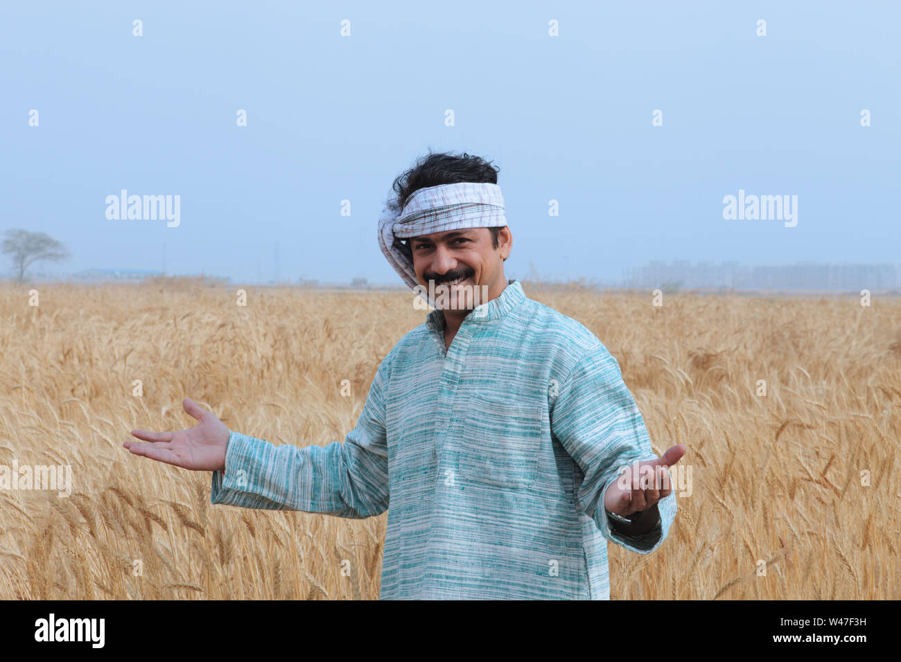 Farmer showing his field Stock Photo - Alamy