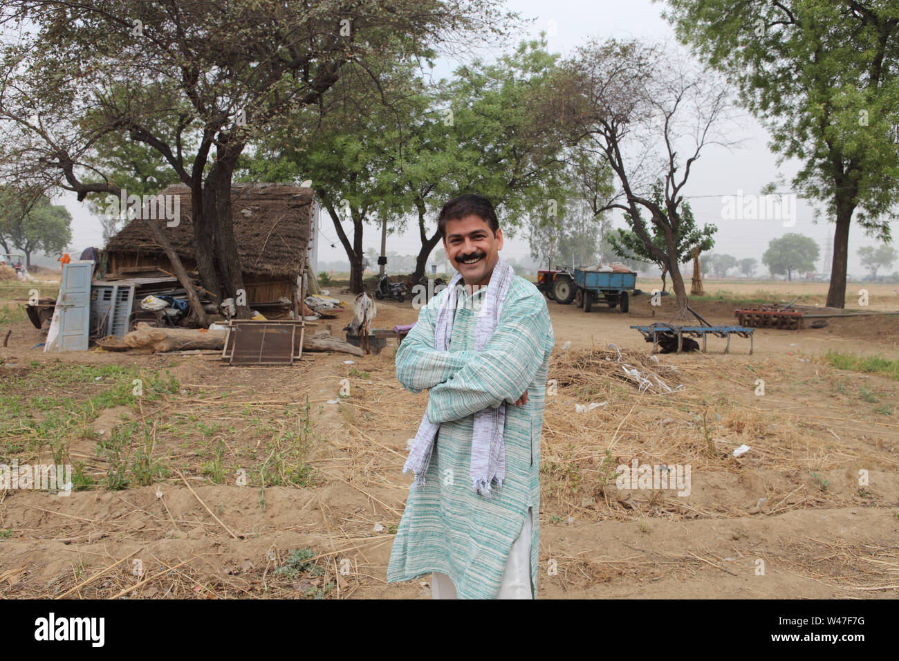 Portrait of a farmer smiling Stock Photo - Alamy