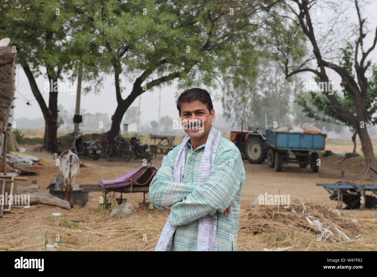 Portrait of a farmer smiling Stock Photo - Alamy