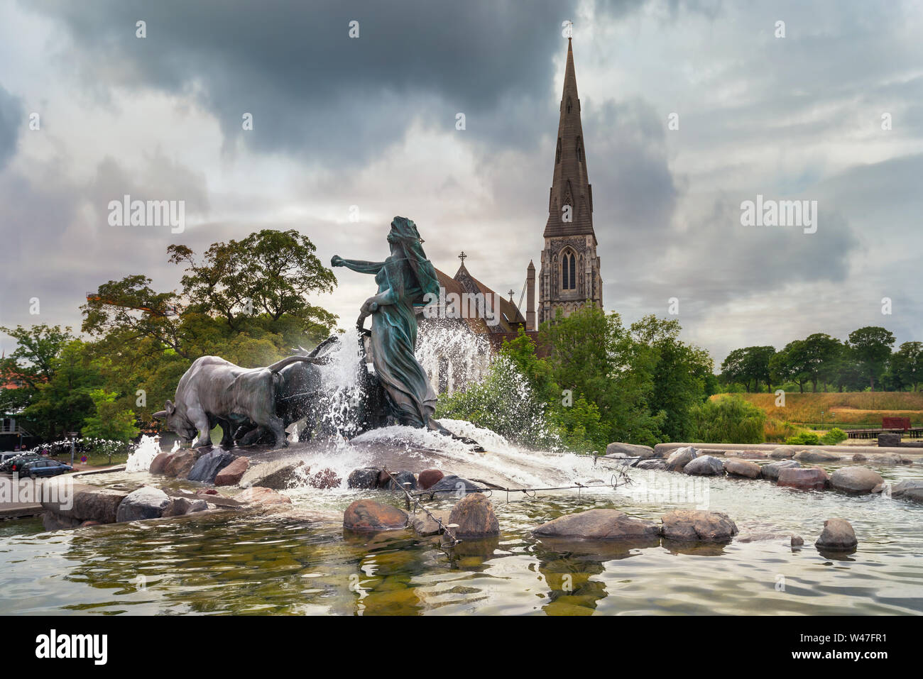 View of Gefion Fountain and St.Alban's Anglican Church in Copenhagen. Denmark Stock Photo