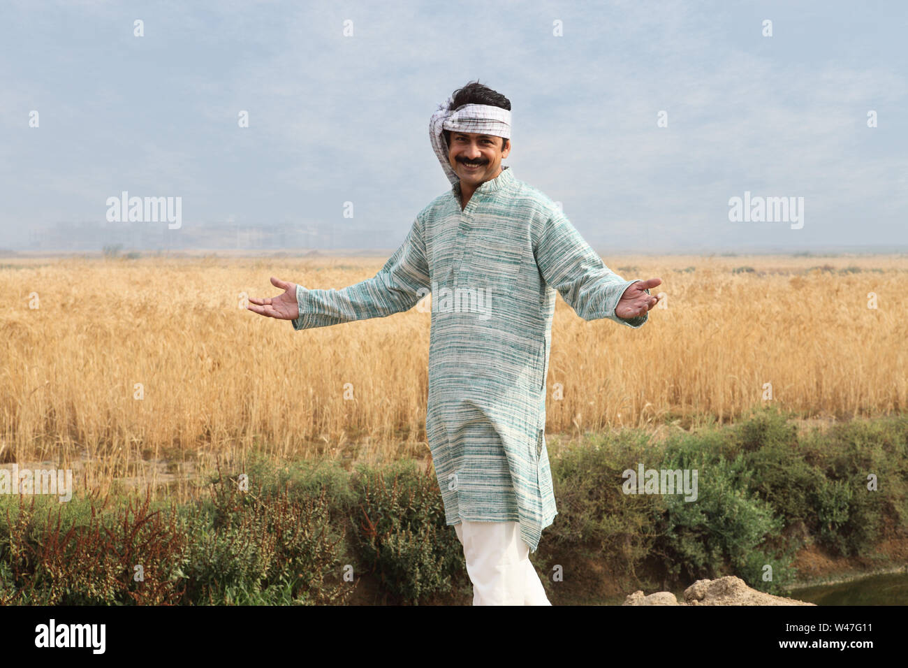 Farmer showing his field Stock Photo - Alamy