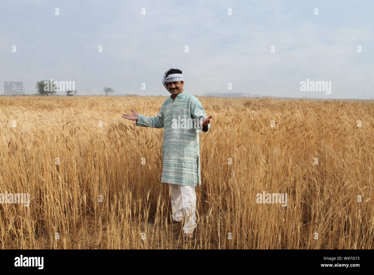 Farmer showing his field Stock Photo - Alamy