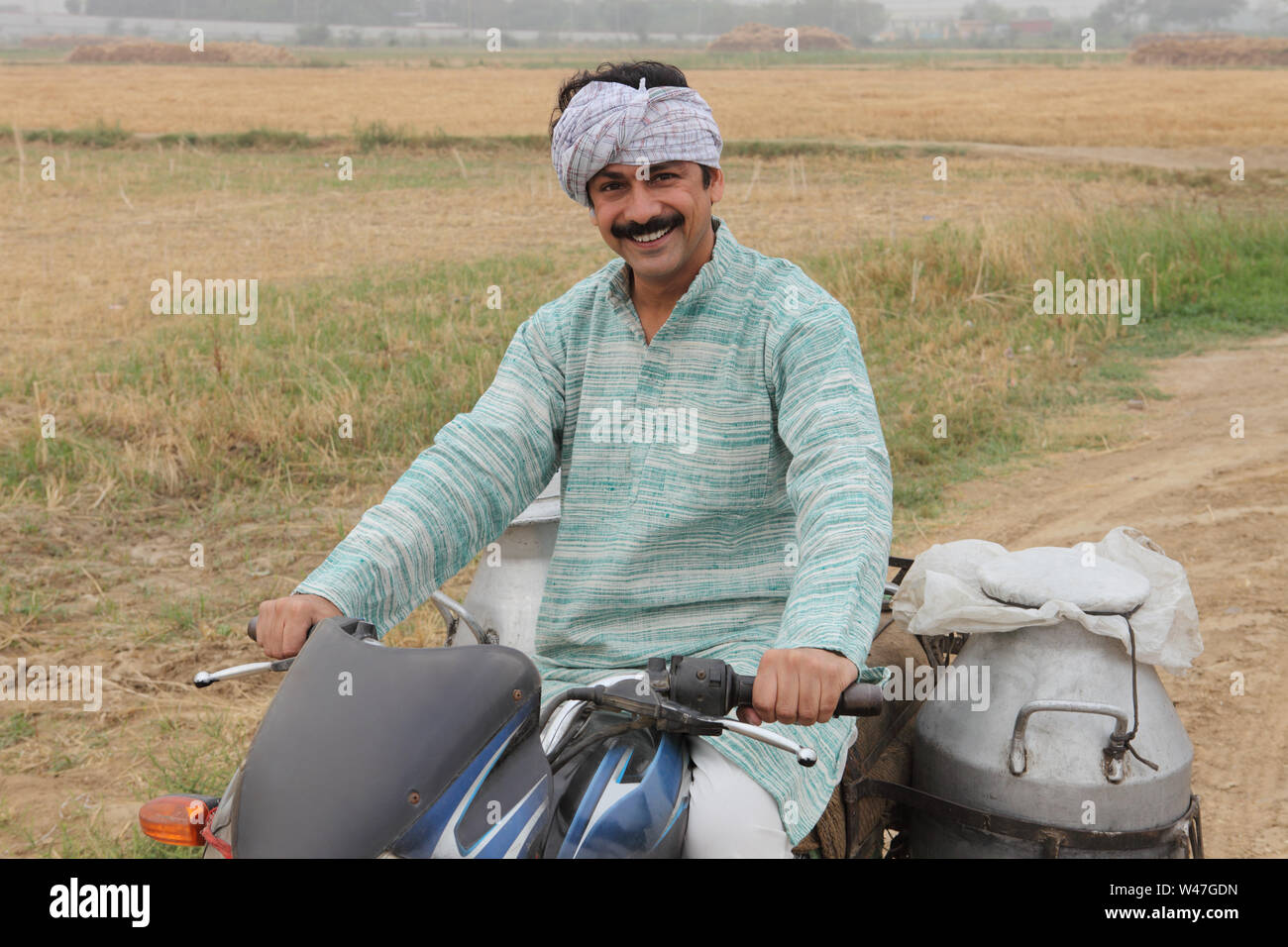 indian-milkman-delivering-milk-on-a-motorcycle-stock-photo-alamy